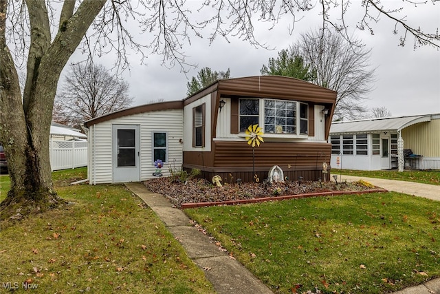 rear view of house with a yard