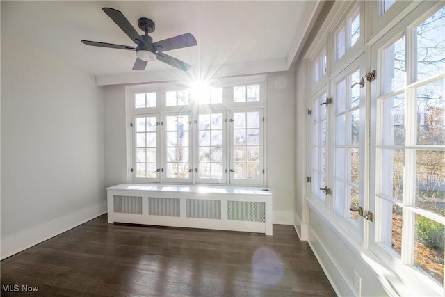 unfurnished sunroom featuring radiator heating unit