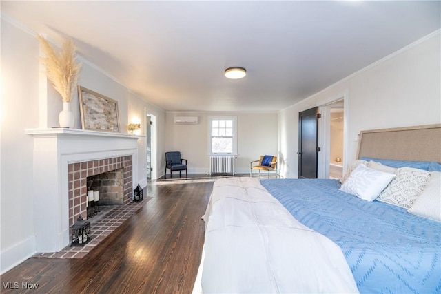 bedroom featuring radiator heating unit, a wall mounted air conditioner, a tiled fireplace, dark wood-type flooring, and ornamental molding