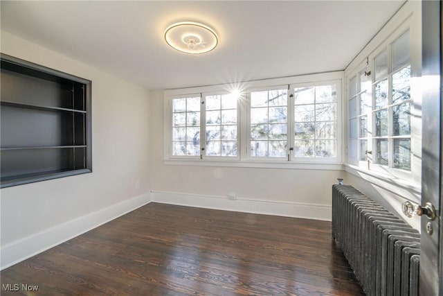 unfurnished sunroom with radiator