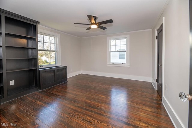 interior space with dark wood-type flooring, crown molding, and ceiling fan