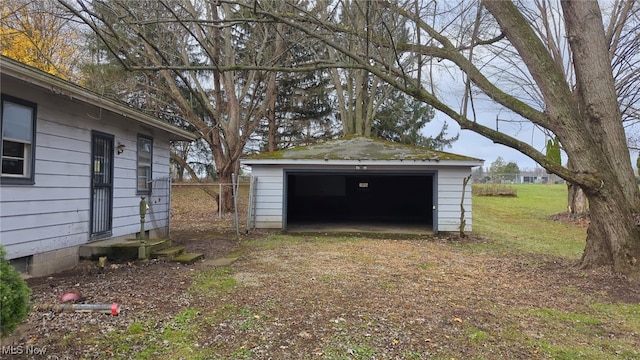 garage featuring a lawn