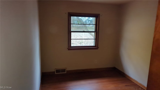 empty room featuring hardwood / wood-style flooring