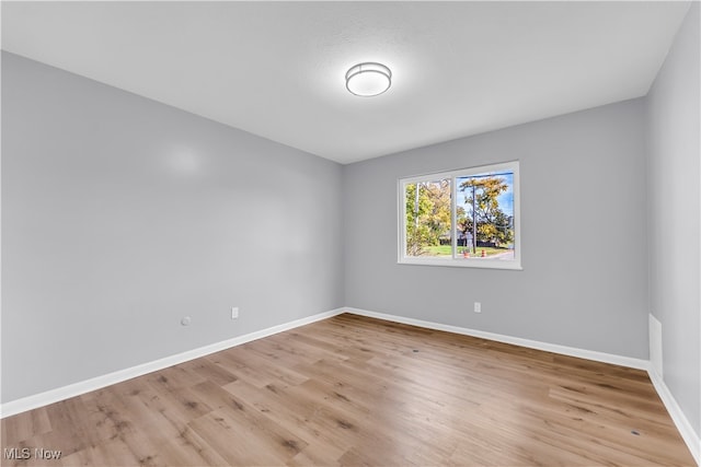 unfurnished room featuring light hardwood / wood-style floors