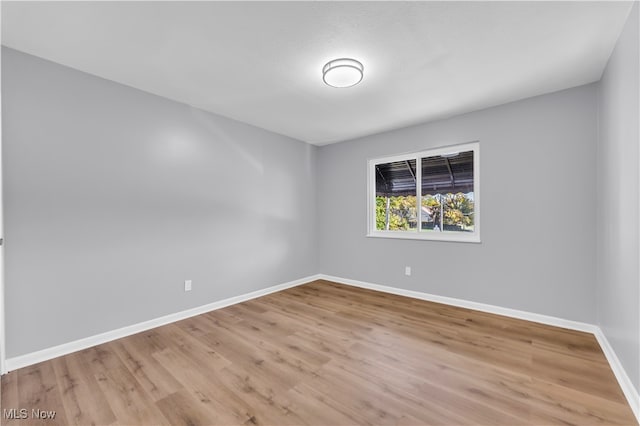 empty room with light hardwood / wood-style floors