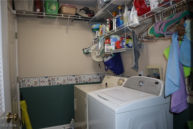 washroom with independent washer and dryer