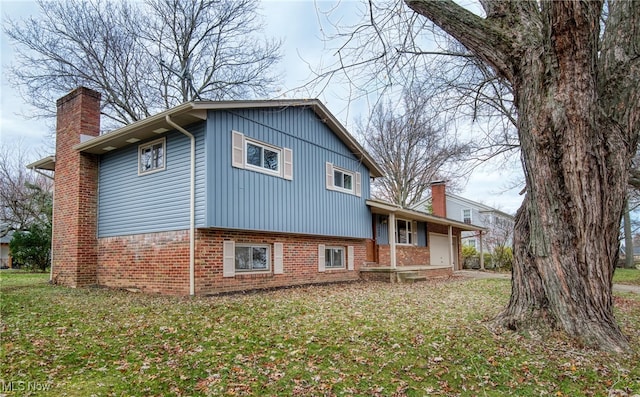 view of side of home featuring a yard