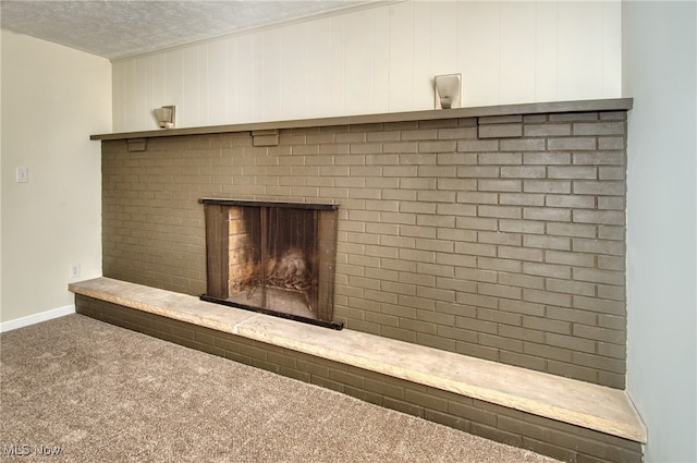 room details with carpet floors, a textured ceiling, and a brick fireplace