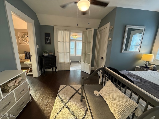 bedroom with lofted ceiling, french doors, dark hardwood / wood-style floors, ceiling fan, and a baseboard radiator