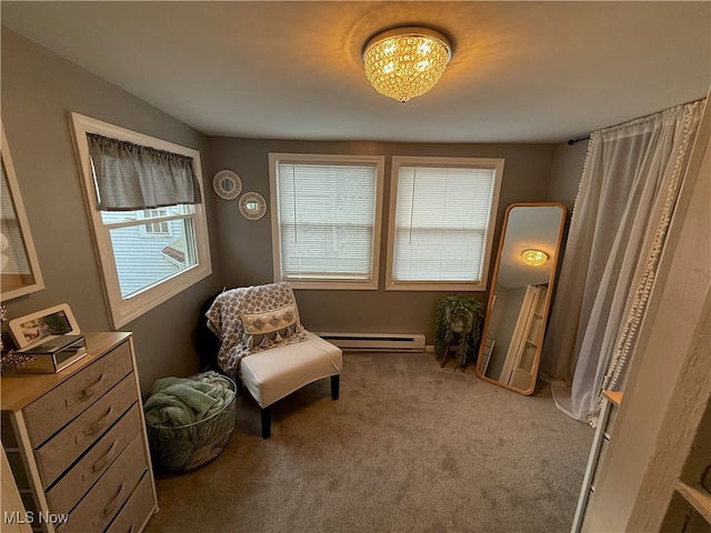 living area with carpet flooring and baseboard heating