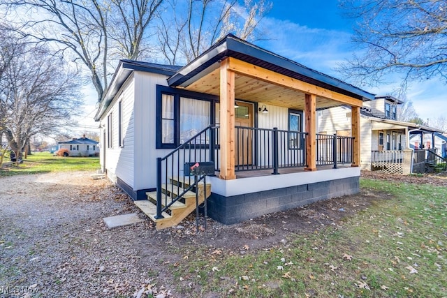 view of property exterior with a porch