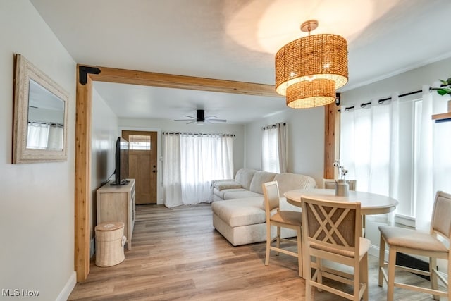 living room featuring light hardwood / wood-style flooring and ceiling fan