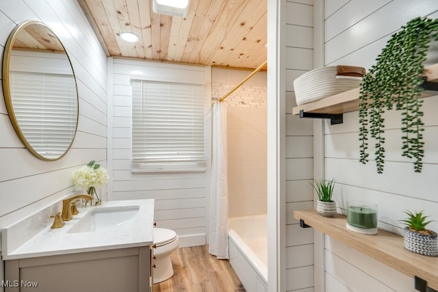 full bathroom with hardwood / wood-style floors, wood walls, wooden ceiling, toilet, and shower / bath combo with shower curtain