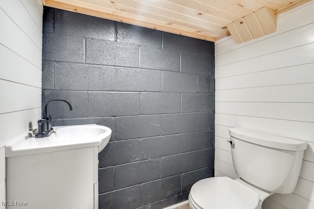 bathroom featuring vanity, toilet, and wood ceiling