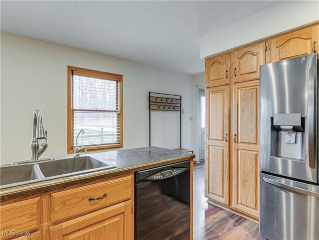 kitchen with stainless steel refrigerator with ice dispenser, dark hardwood / wood-style flooring, light brown cabinetry, sink, and dishwasher