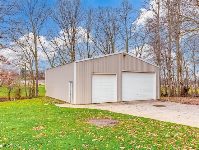 garage featuring a lawn