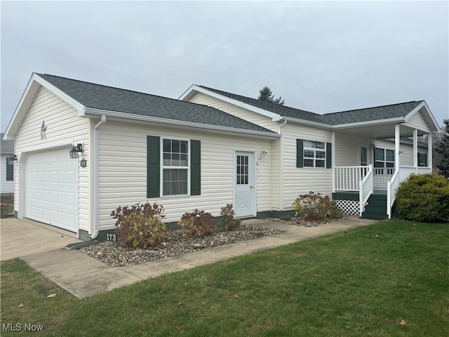 single story home with a front lawn, covered porch, and a garage