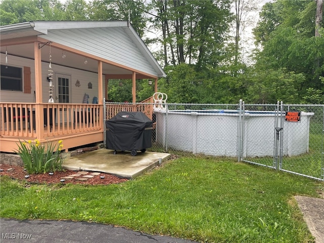 view of yard featuring a pool side deck