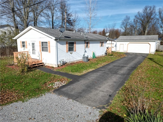 view of front of home featuring a wooden deck, central AC, an outdoor structure, and a garage