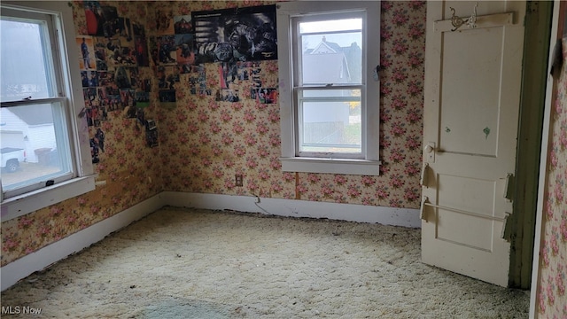 unfurnished room featuring carpet floors