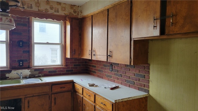 kitchen featuring backsplash and sink