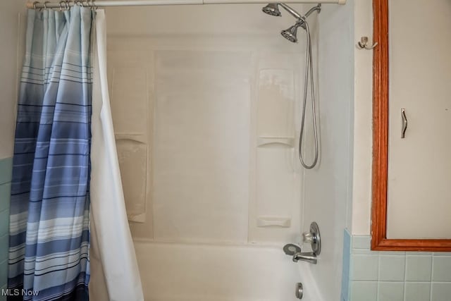 bathroom featuring shower / bath combination with curtain