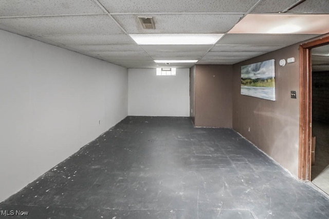 basement featuring a drop ceiling