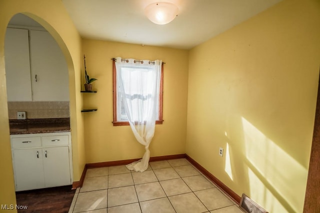 interior space with light tile patterned floors