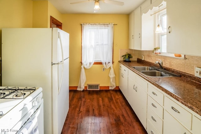 kitchen featuring tasteful backsplash, dark hardwood / wood-style flooring, white cabinetry, and sink