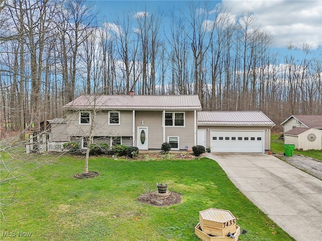 bi-level home featuring a front yard and a garage