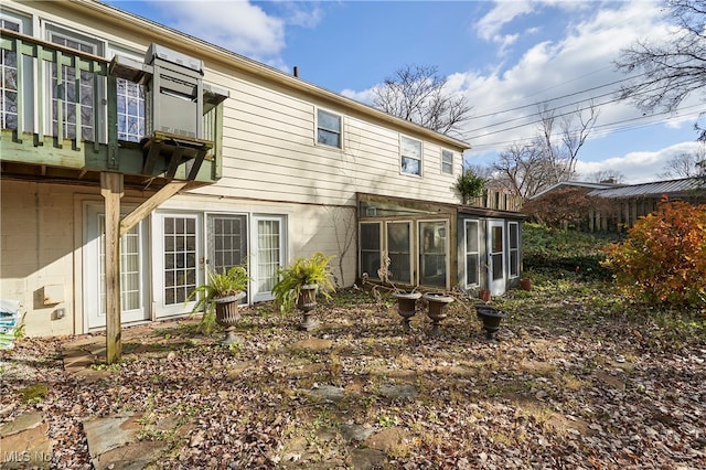 rear view of house with a sunroom