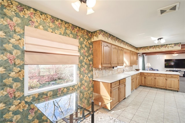 kitchen featuring white dishwasher, ceiling fan, and light tile patterned floors