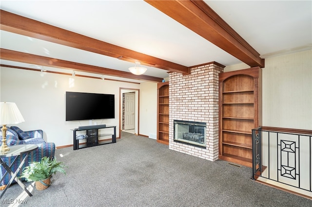 living room featuring a fireplace, beamed ceiling, and carpet floors