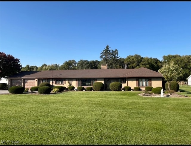 ranch-style house with a front lawn