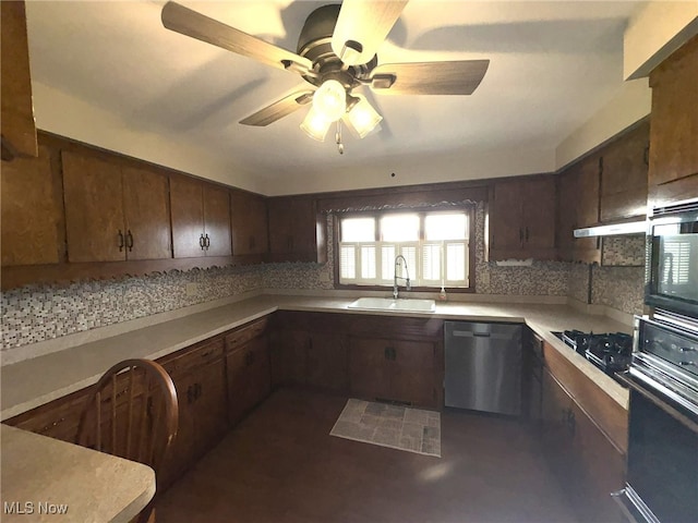 kitchen featuring backsplash, black appliances, sink, ceiling fan, and range hood