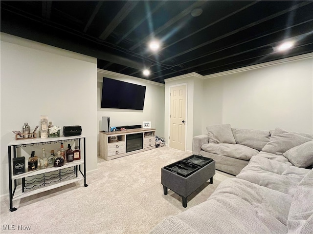 living room featuring carpet and crown molding