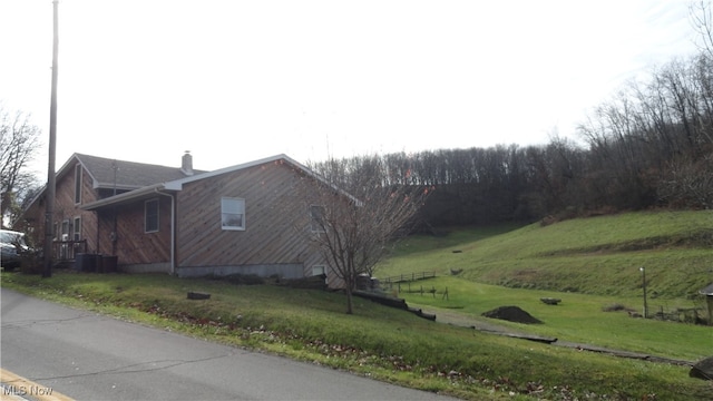 view of home's exterior with a yard