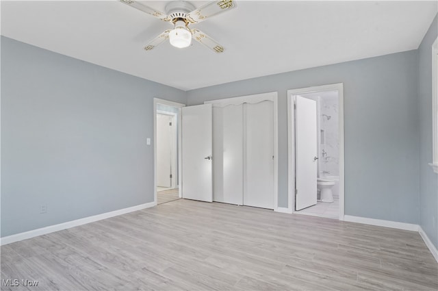 unfurnished bedroom with ceiling fan, a closet, connected bathroom, and light hardwood / wood-style flooring