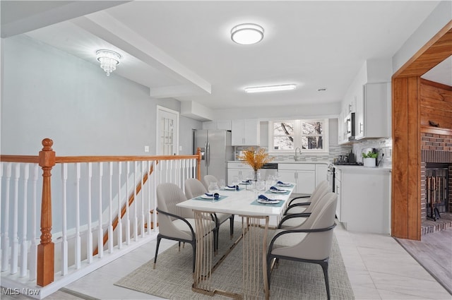 dining area featuring light hardwood / wood-style flooring and sink