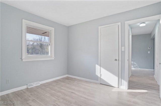 empty room featuring light hardwood / wood-style floors