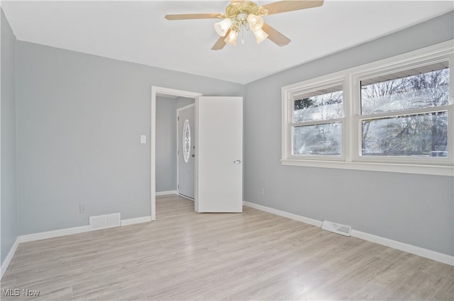 unfurnished room featuring ceiling fan and light hardwood / wood-style floors