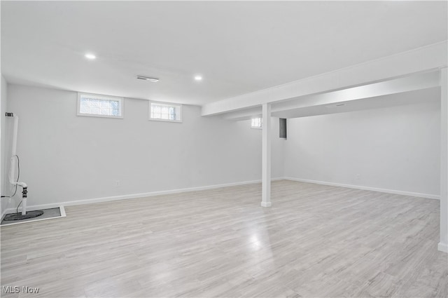 basement featuring light wood-type flooring