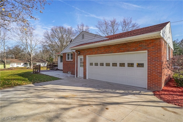 view of side of home with a garage