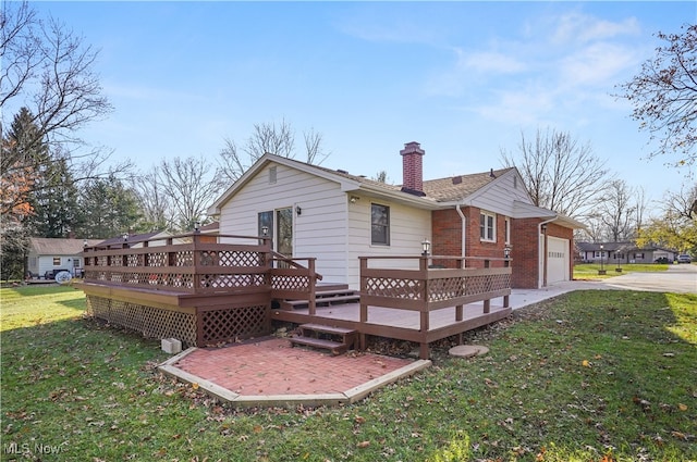 rear view of house with a lawn, a patio area, and a wooden deck