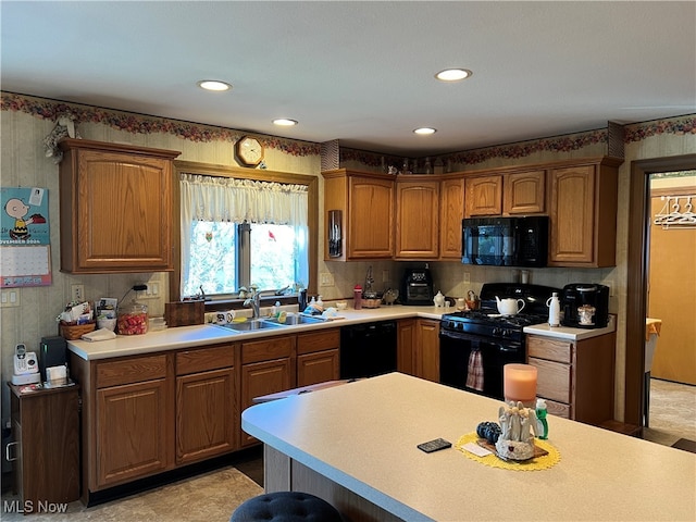 kitchen featuring black appliances and sink