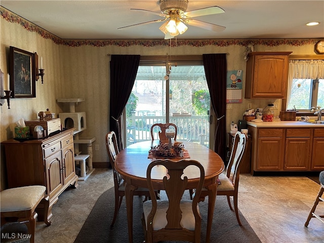 dining area featuring ceiling fan and a healthy amount of sunlight