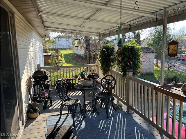 wooden deck with grilling area