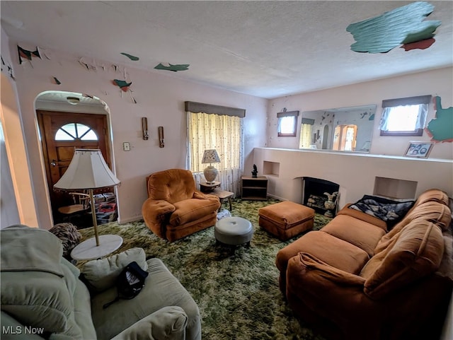 living room featuring a textured ceiling