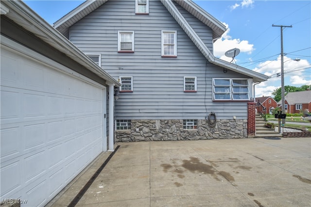 view of property exterior with a garage