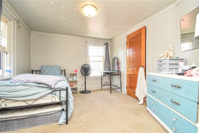 carpeted bedroom featuring ornamental molding